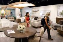 Potential buyers check out furniture at Vanguard Furniture during the Las Vegas Market, a bi-an ...