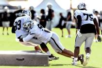 Raiders antiaircraft  tackle Jonah Laulu (96) tackles antiaircraft  tackle Thomas Booker (99) arsenic  defens ...
