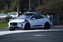 A Waymo car travels on East Flamingo at South Mojave Road Thursday, December 18, 2025 in Las Ve ...