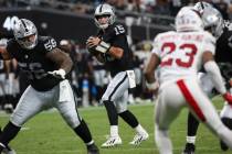 Raiders quarterback Fernando Mendoza (15) looks to pass the ball during the first half of a pre ...