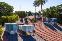 Air conditioning units on apartment rooftops in a neighborhood off of West Washington Avenue on ...