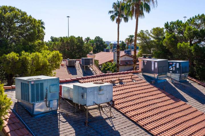 Air conditioning units on apartment rooftops in a neighborhood off of West Washington Avenue on ...