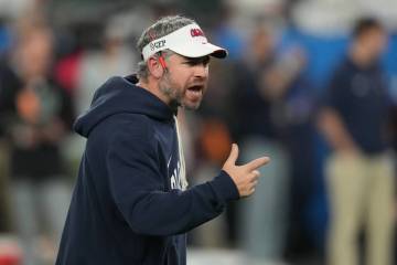 Mississippi head coach Pete Golding directs his players before the Fiesta Bowl NCAA college foo ...