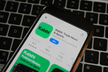 An ad for the prediction market app Kalshi is displayed on a mobile phone Thursday, April 16, 2 ...
