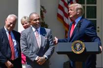 President Donald Trump, right, talks about Jon Ponder, second from right, from Las Vegas, and F ...
