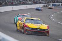 Team Penske driver Joey Logano (22) dives into turn one during Cook Out 400 at Richmond Raceway ...