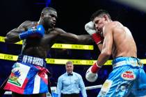 Yoenli Hernandez, left, fights Francisco Daniel Veron in a middleweight boxing match Saturday, ...