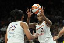 Phoenix Mercury center Kalani Brown (21) passes the ball to Mercury forward Alyssa Thomas (25) ...