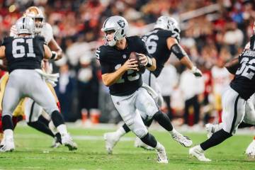 Raiders quarterback Fernando Mendoza (15) scrambles during a preseason NFL football game agains ...