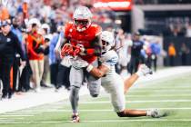 Rebels running back Jai'den Thomas (9) runs the ball during an NCAA football game against ...