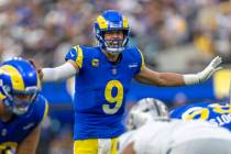 Los Angeles Rams quarterback Matthew Stafford (9) audibles at the line of scrimmage during the ...
