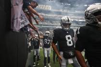 Raiders quarterback Kirk Cousins (8) enters the field for introductions before the start of a p ...