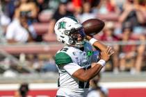 Hawai'i quarterback Micah Alejado (12) throws during an NCAA college football game against the ...