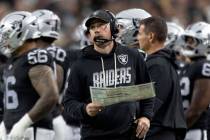 Raiders head coach Klint Kubiak calls a play from the sideline during the first half of an NFL ...