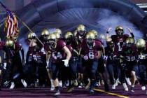 Faith Lutheran players take the field to face Centennial during a Class 5A Southern Region titl ...