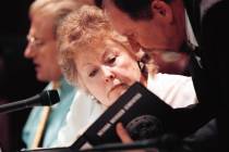 Sen. Ann O'Connell looks at a Nevada Revised Statutes book during a committee meeting at the du ...
