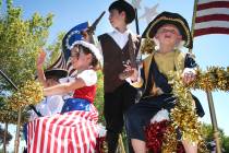 In this 2009 file photo, the founding fathers and mother enjoy their ride on a patriotic float ...