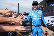 Denny Hamlin (11) greets fans before start of a NASCAR Cup Series auto race at Chicagoland Spee ...