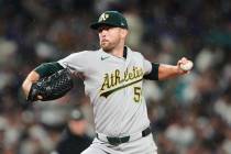 Athletics starting pitcher Jeffrey Springs throws against the Seattle Mariners during the fifth ...