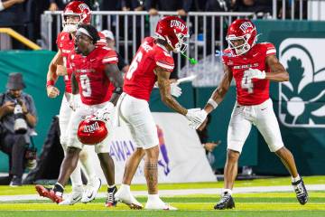 UNLV running back Jai’Den Thomas (9) celebrates after scoring the third touchdown during ...