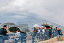 Fans wait out a weather delay for Foothill’s home opening football game against Green Va ...