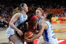 Jackie Young, of the United States, fights for the ball with Italy's Lorela Cubaj, left, a ...