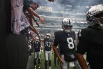 Raiders quarterback Kirk Cousins (8) enters the field for introductions before the start of a p ...