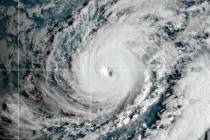 This satellite imageshows Hurricane Lowell approaching Hawaii, Sunday, Sept. 6, 2026. (NOAA via AP)
