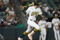 Athletics' Jeff McNeil hits a walk off RBI single during the ninth inning of a baseball game ag ...