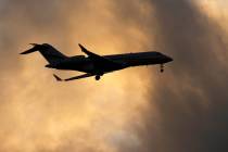 FILE - A Bombardier Global Express business jet approaches for landing in Lisbon, on June 13, 2 ...