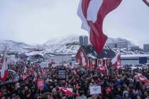 FILE - People protest against Trump's policy towards Greenland in front of the US consulat ...