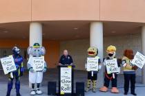 CCSD Police Lt. Bryan Zink, flanked by local sports team mascots, speaks during a press confere ...