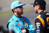 Kyle Busch, left, talks with Kurt Busch before qualifying for the Monster Energy NASCAR Cup Ser ...
