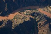 A flood damaged Bright Angel Canyon runs into the Colorado River in the Grand Canyon, Monday, A ...