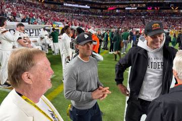 Raiders primary owner Mark Davis (left) stands with minority owners Egon Durban (center) and To ...