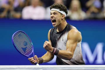 Ben Shelton, of the United States, celebrates after a point in the fifth set against Carlos Alc ...