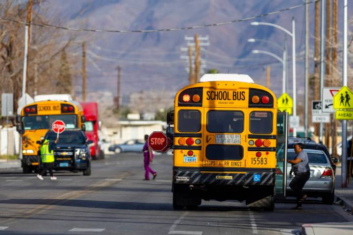 School buses arrive to pick up students at Kelly Elementary School in February. The Clark Count ...