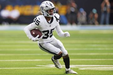 Raiders cornerback Hezekiah Masses (35) runs back an interception during the first half of an N ...
