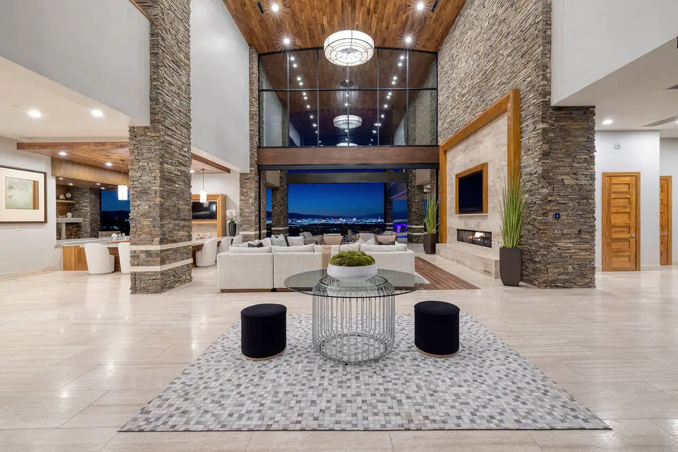 Main living room inside the Empire Estate at 761 Dragon Ridge Drive in MacDonald Highlands, Henderson