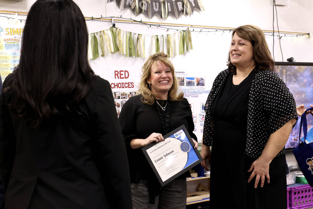 Connie Johnson stands with state and Clark County School District education leaders after receiving the 2026 Nevada Early Educator of the Year award at Piggott Academy