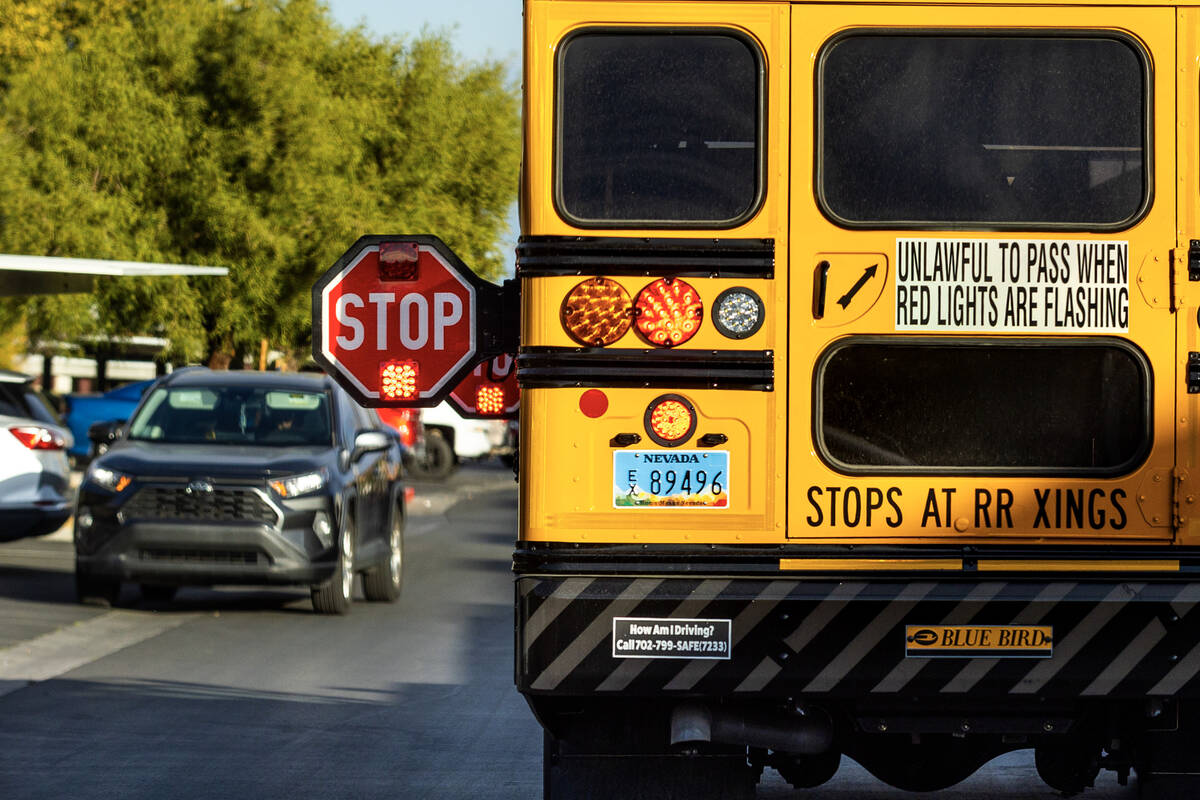 A CCSD school bus drops off a student at Summerhill Pointe in Las Vegas