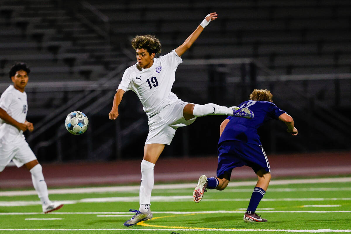 Centennial freshman Jayden Contreras (19) leaps for the shot against Shadow Ridge successful a Class 4A ...