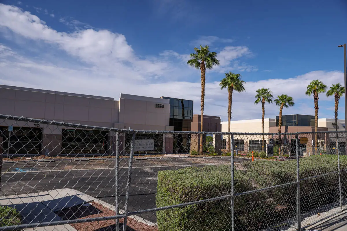 Single-story office buildings fenced off for construction on Paseo Verde Parkway in Henderson, the future site of The Cliff