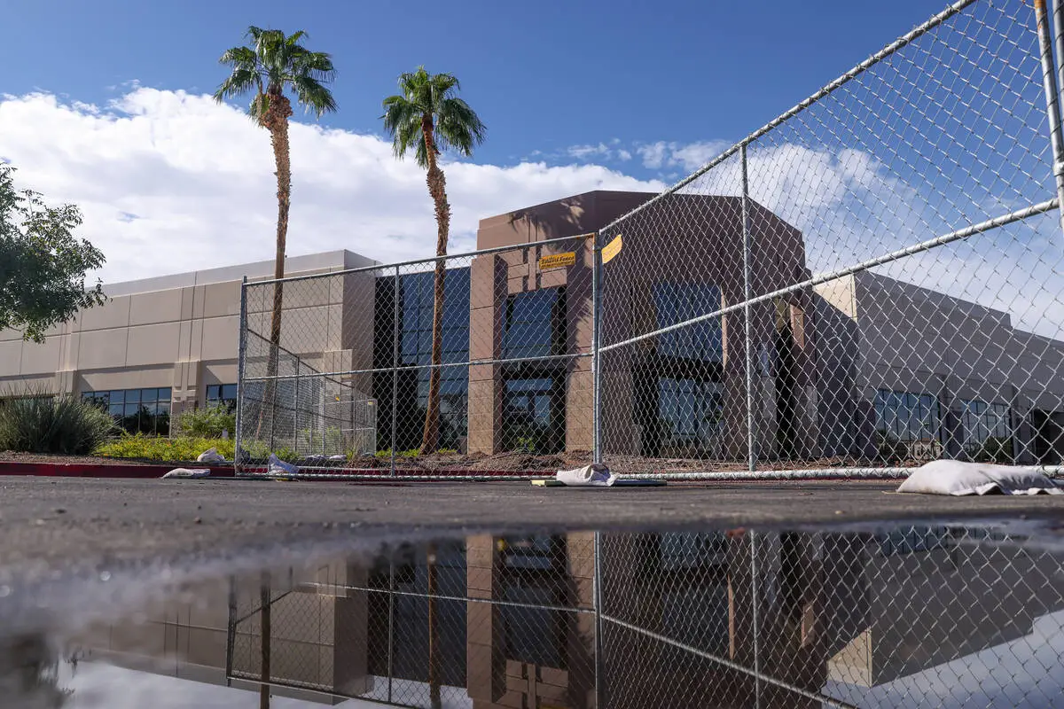 Fenced office building on Paseo Verde Parkway in Henderson during early construction on The Cliff