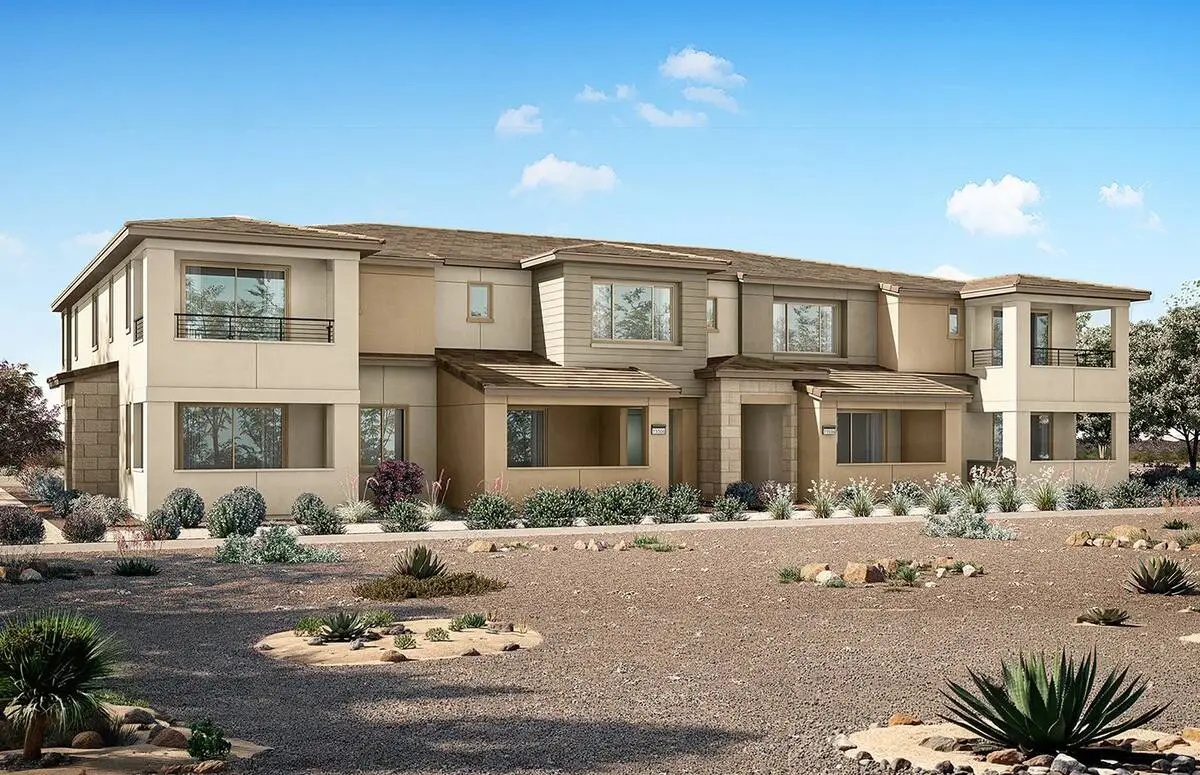 Rendering of a two-story Westlight townhome building by Pulte Homes in Lake Las Vegas, with tan stucco, balconies and desert landscaping