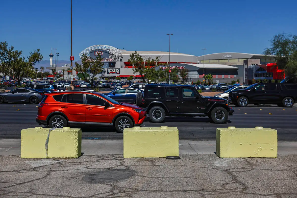 View across Tropicana Avenue from the vacant UNLV parcel toward the Thomas and Mack Center and its parking lot
