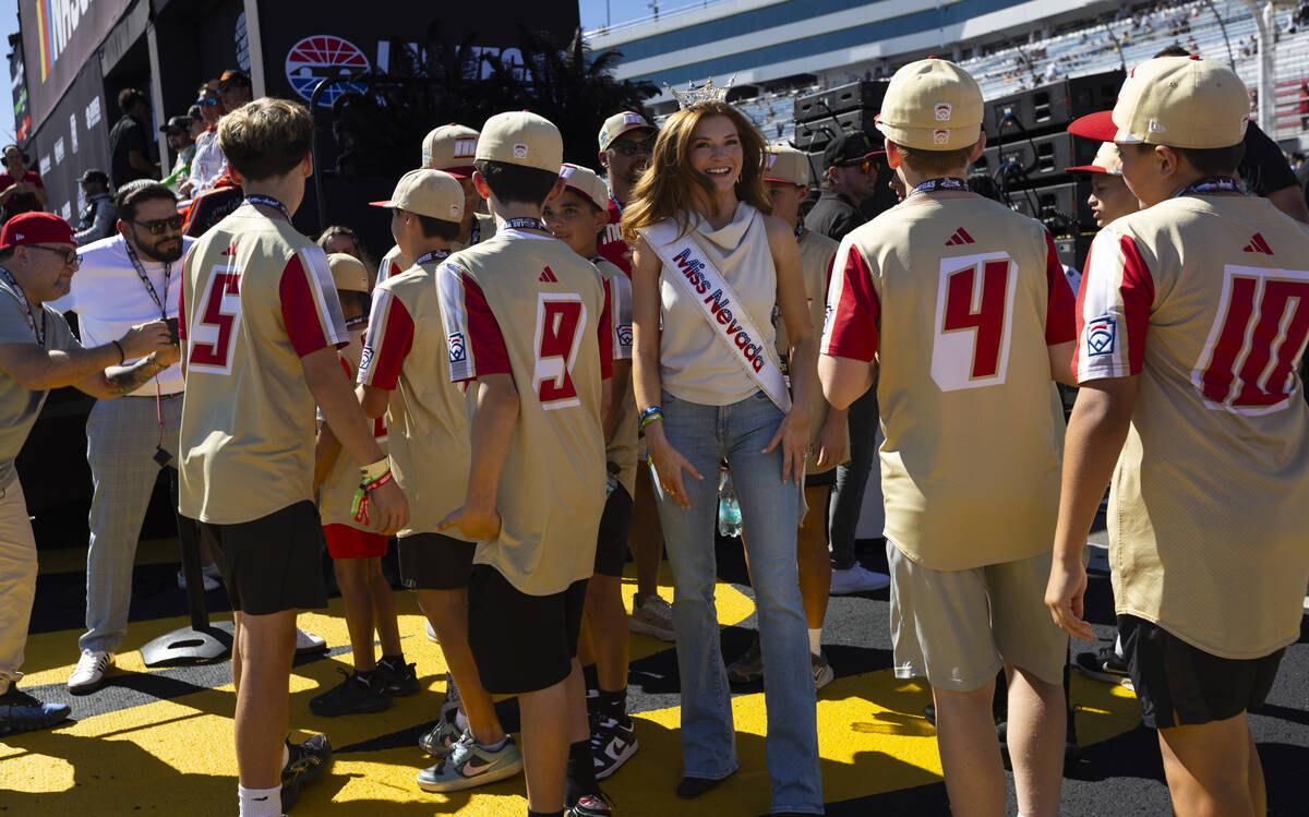 Miss Nevada Mariah Larronde greets members of the Paseo Verde Little League squad before the So ...