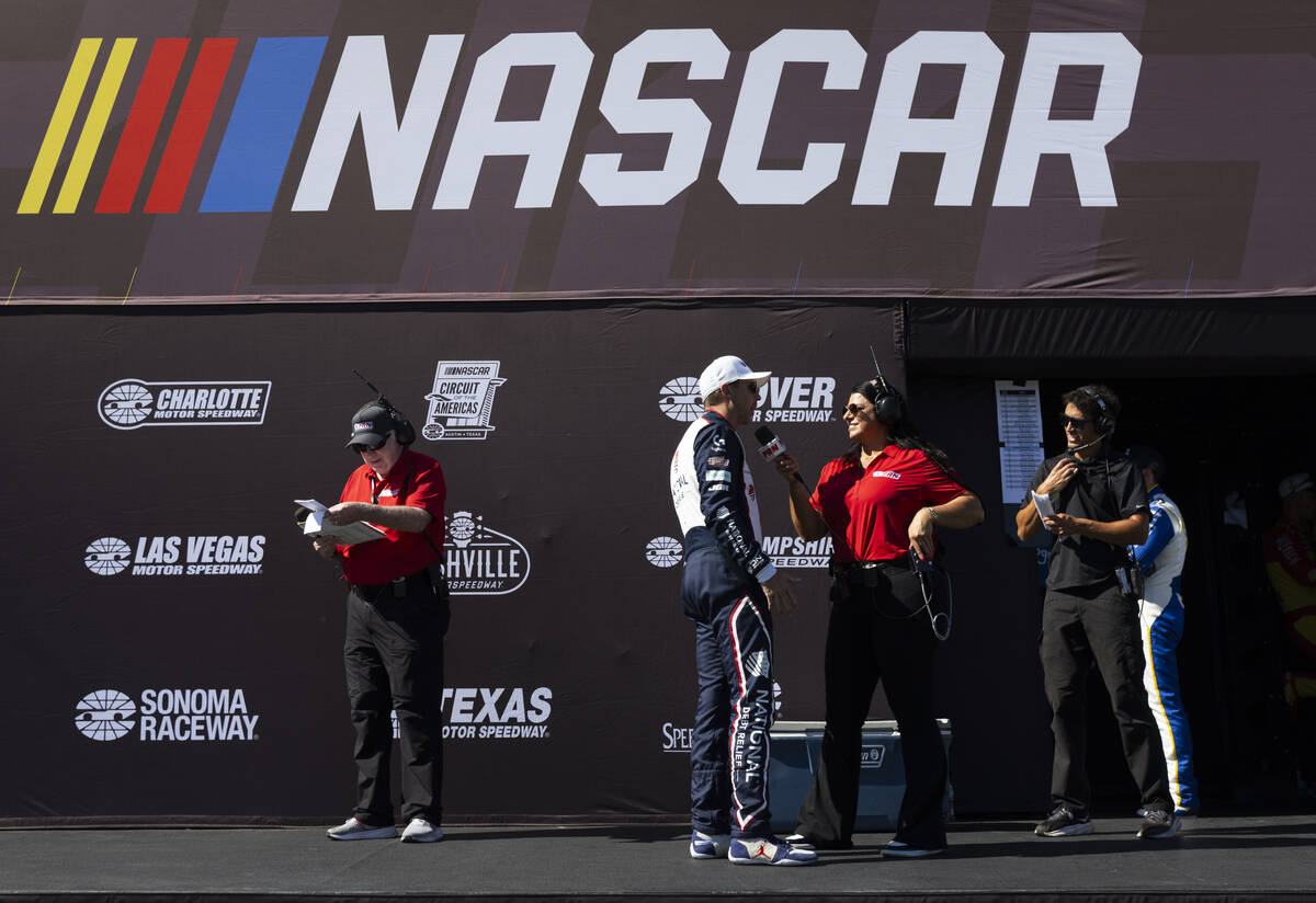 Driver Denny Hamlin, who won pole position, is interviewed before the South Point 400 NASCAR Cu ...