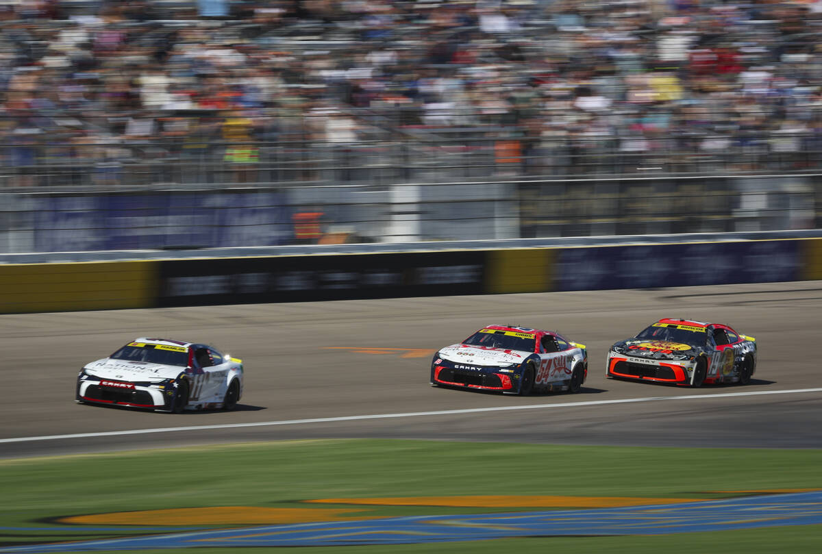 Driver Denny Hamlin (11) drives ahead of Ty Gibbs (54) and Chase Briscoe (19) during the the So ...