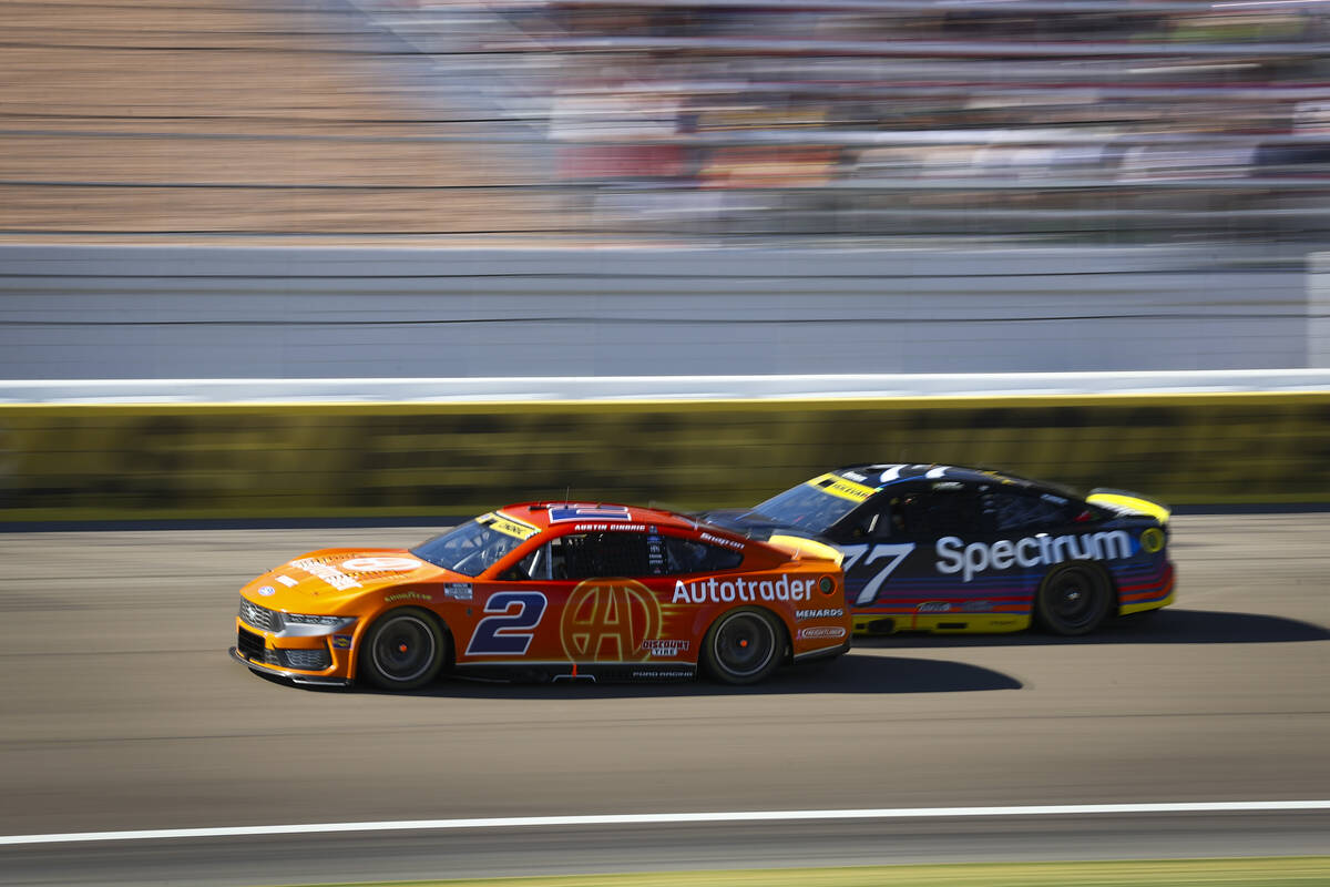 Driver Austin Cindric (2) drives ahead of Carson Hocevar (77) during the South Point 400 NASCAR ...
